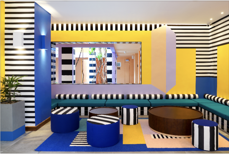 A colorful 80's style interior design hotel in Mauritus, y Camille Walala.